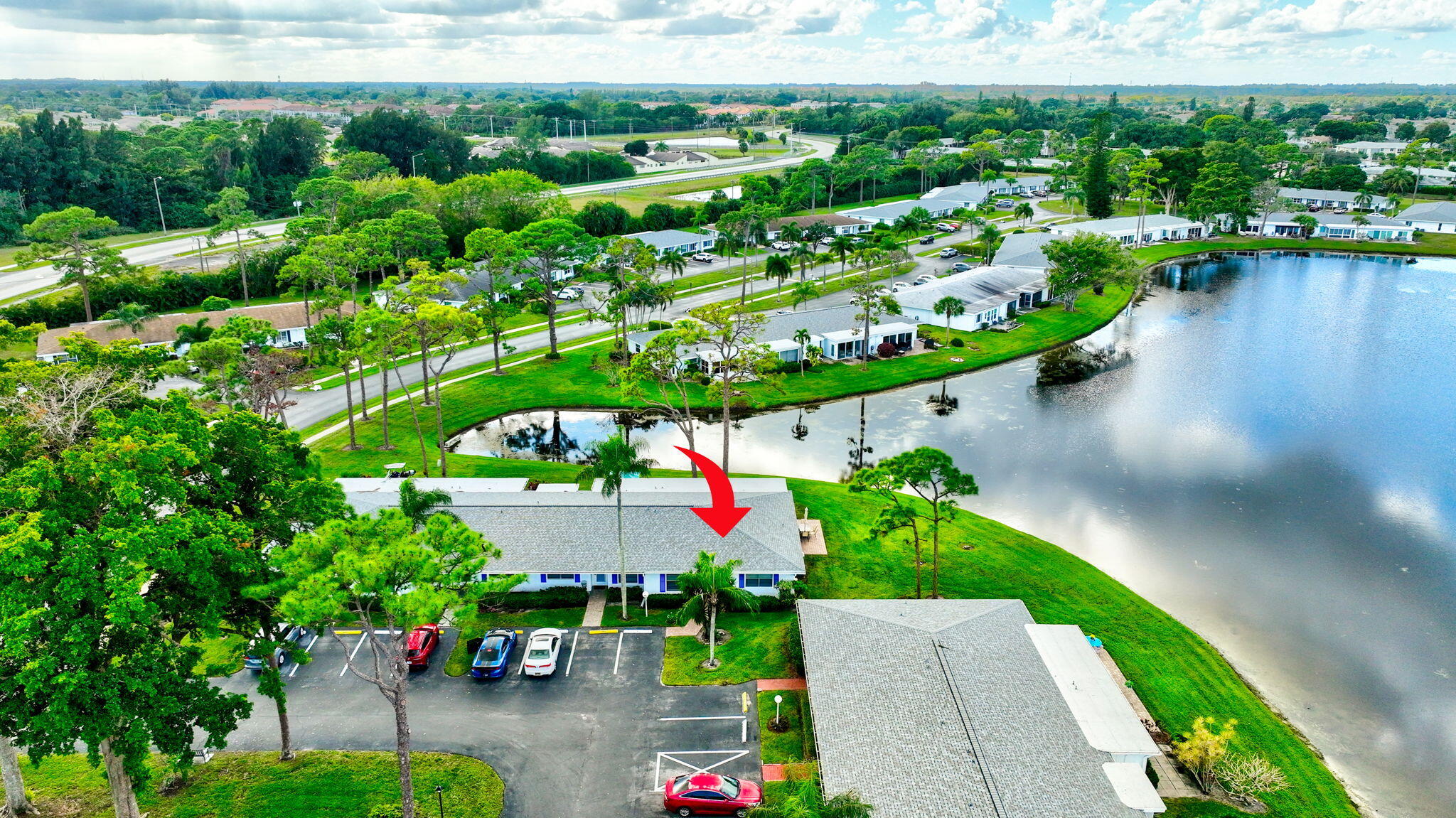5263 Privet Place, Unit D Delray Beach, FL 33484 - Photo 44 of 60 an aerial view of a house with a garden and lake view