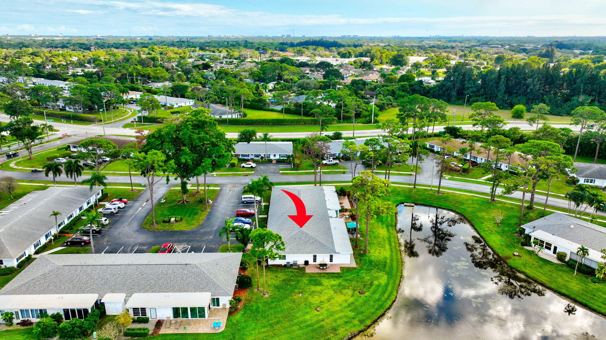 5263 Privet Place, Unit D Delray Beach, FL 33484 - Photo 47 of 60 an aerial view of a house with a garden and lake view