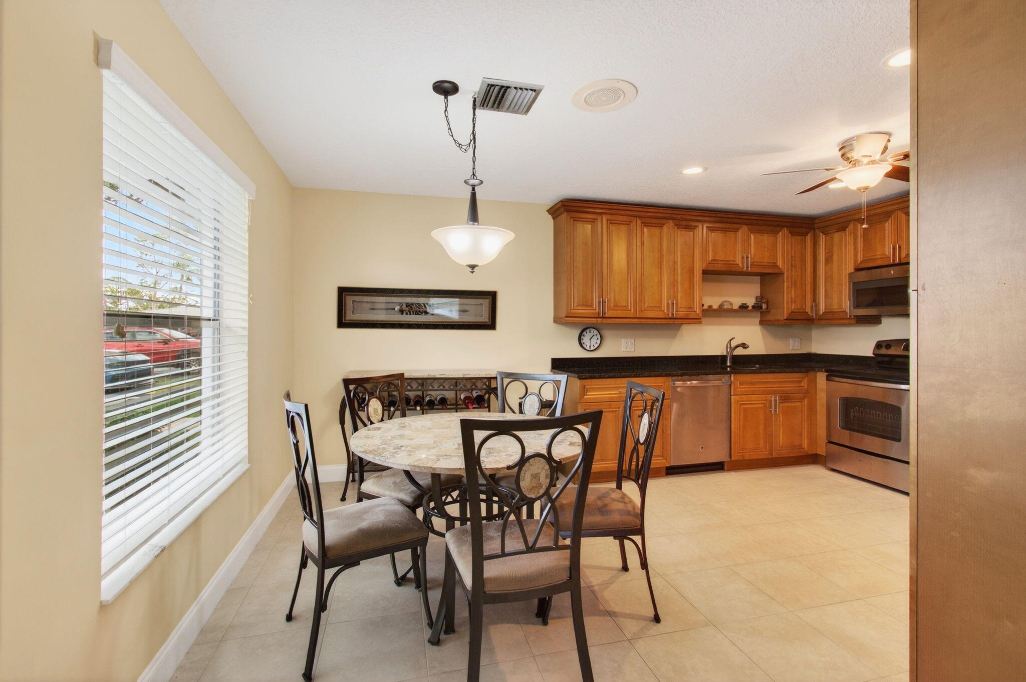 5263 Privet Place, Unit D Delray Beach, FL 33484 - Photo 8 of 60 a view of a dining room with furniture and wooden floor
