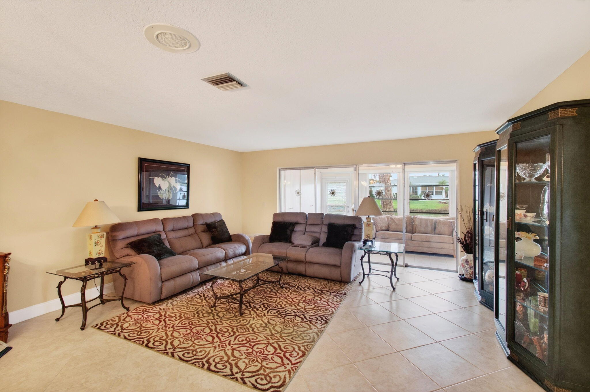 5263 Privet Place, Unit D Delray Beach, FL 33484 - Photo 10 of 60 a living room with furniture and a flat screen tv