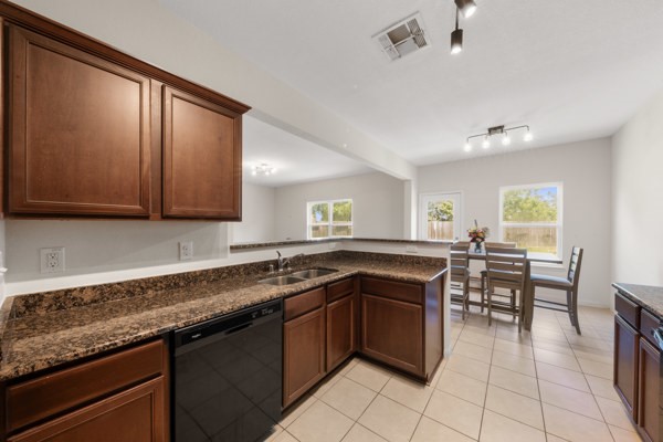 1327 Diamond Drape Drive Rosharon, TX 77583 - Photo 9 of 26 a kitchen with a sink a counter space cabinets and appliances