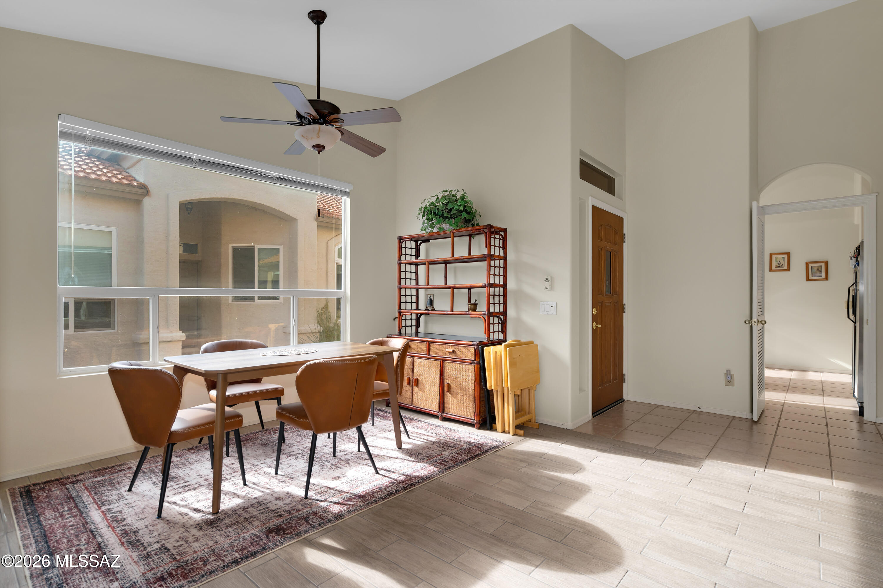 64351 East Wind Ridge Circle Tucson, AZ 85739 - Photo 6 of 41 a view of a dining room with furniture and a chandelier