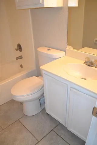 a bathroom with a toilet and a bathtub