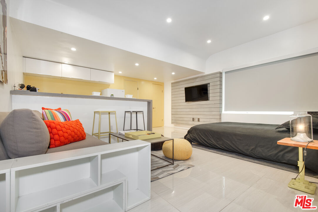 508 North Kings Road, Unit 5 West Hollywood, CA 90048 - Photo 2 of 8 a bedroom with a bed and a couch