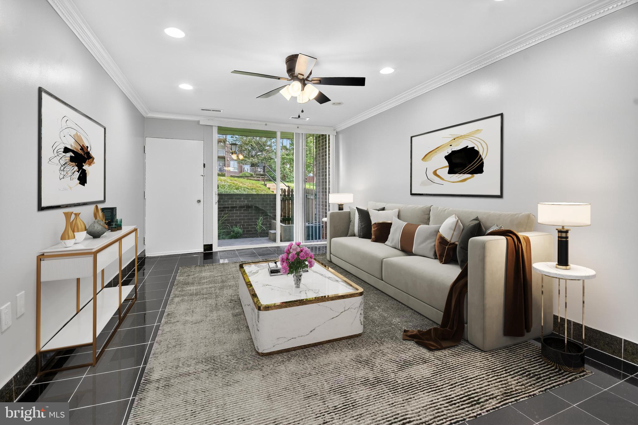 3976 Bel Pre Road, Unit 39761 Silver Spring, MD 20906 - Photo 1 of 19 a living room with furniture and a large window