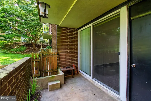 a view of porch with a door