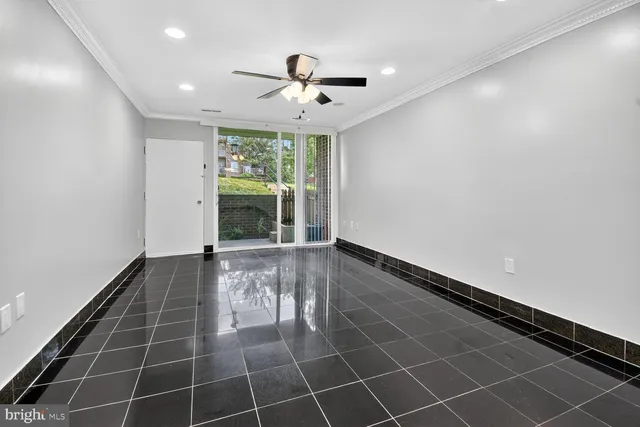 a view of an empty room with a window