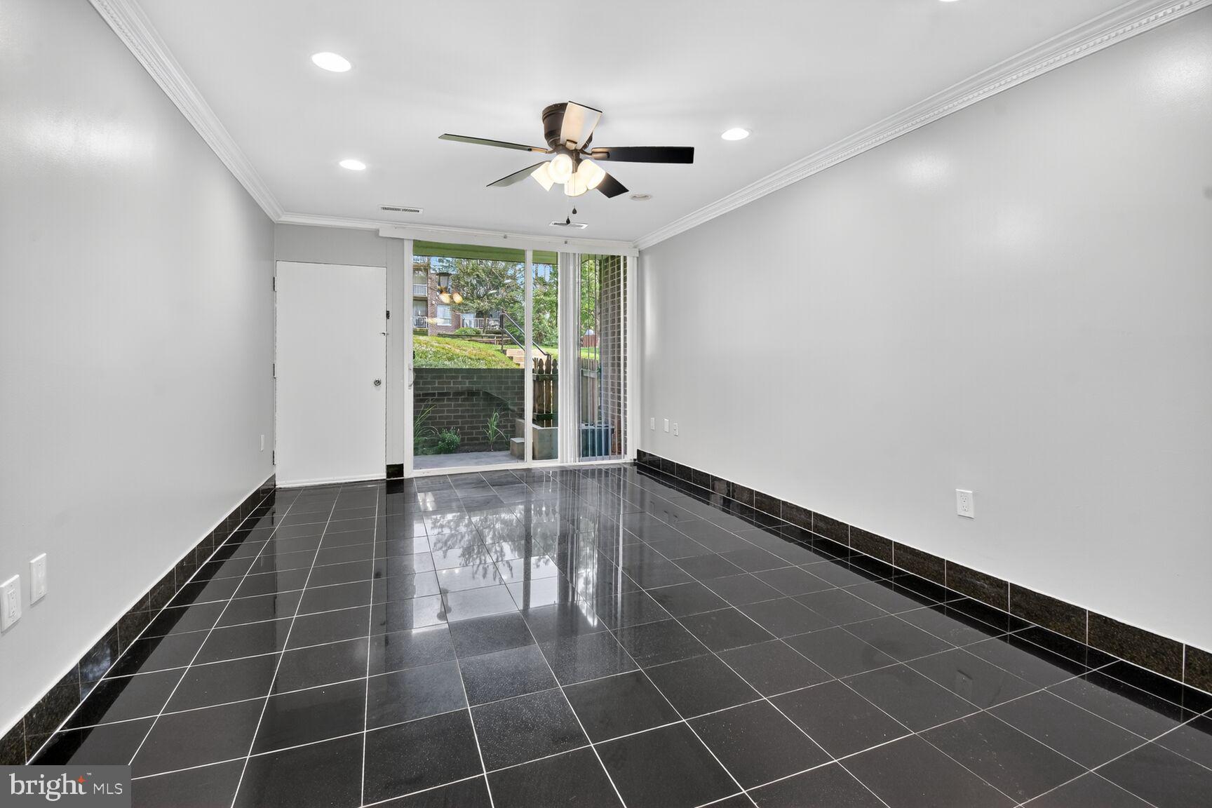 3976 Bel Pre Road, Unit 39761 Silver Spring, MD 20906 - Photo 17 of 19 a view of an empty room with a window