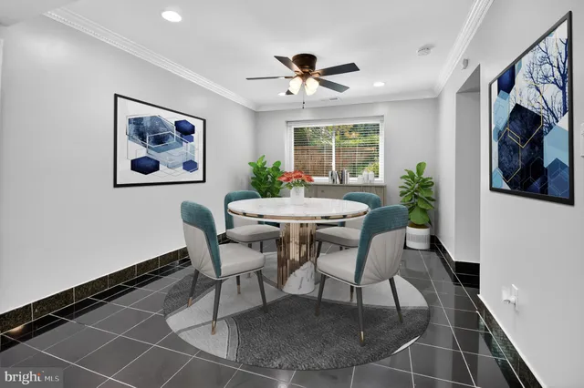 a dining room with furniture and window