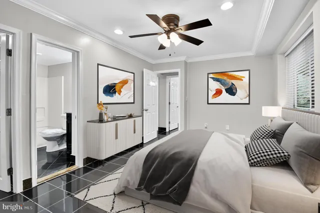 a spacious bedroom with a bed and a painting on the wall