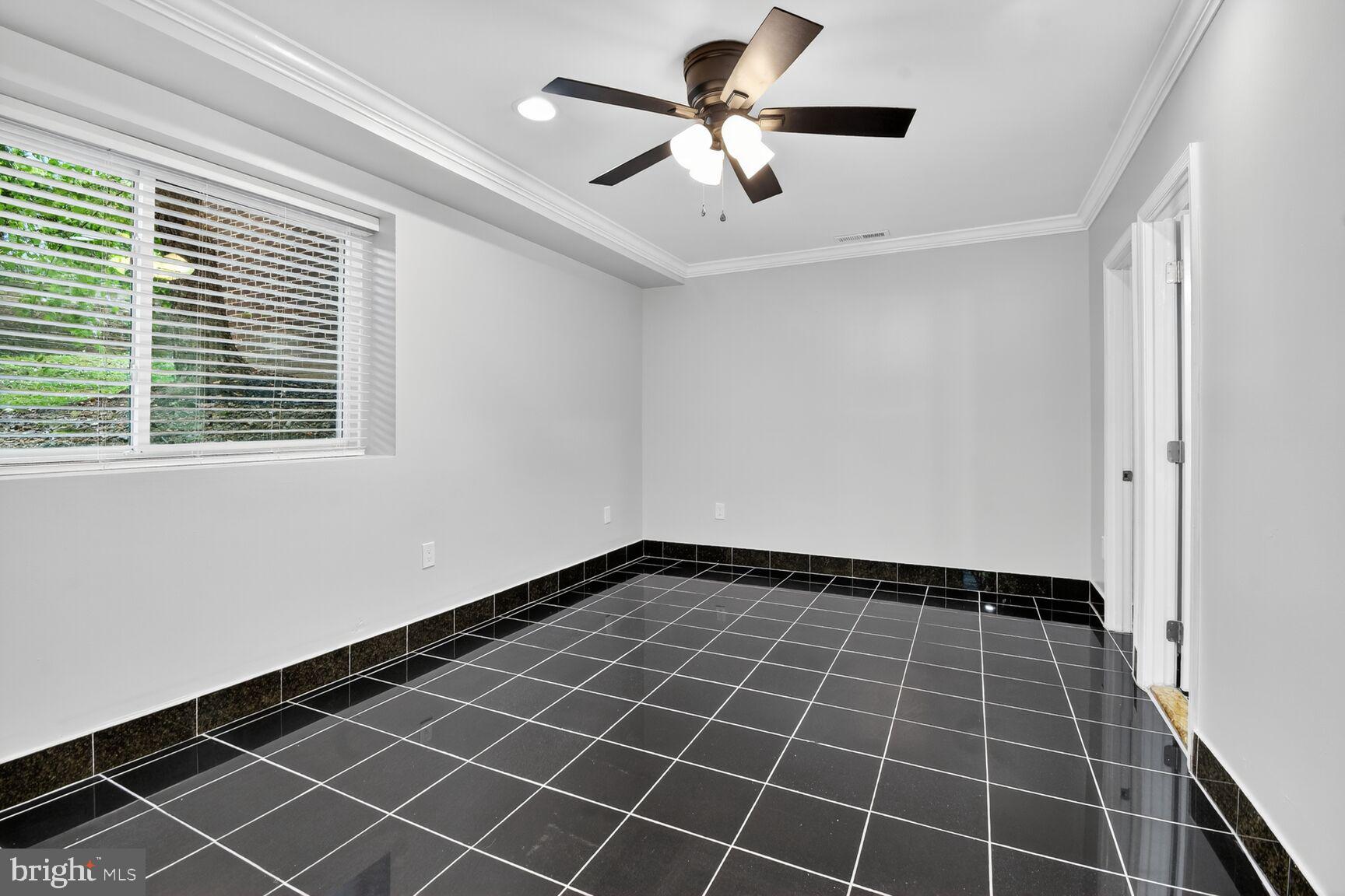 3976 Bel Pre Road, Unit 39761 Silver Spring, MD 20906 - Photo 8 of 19 a view of an empty room with a window