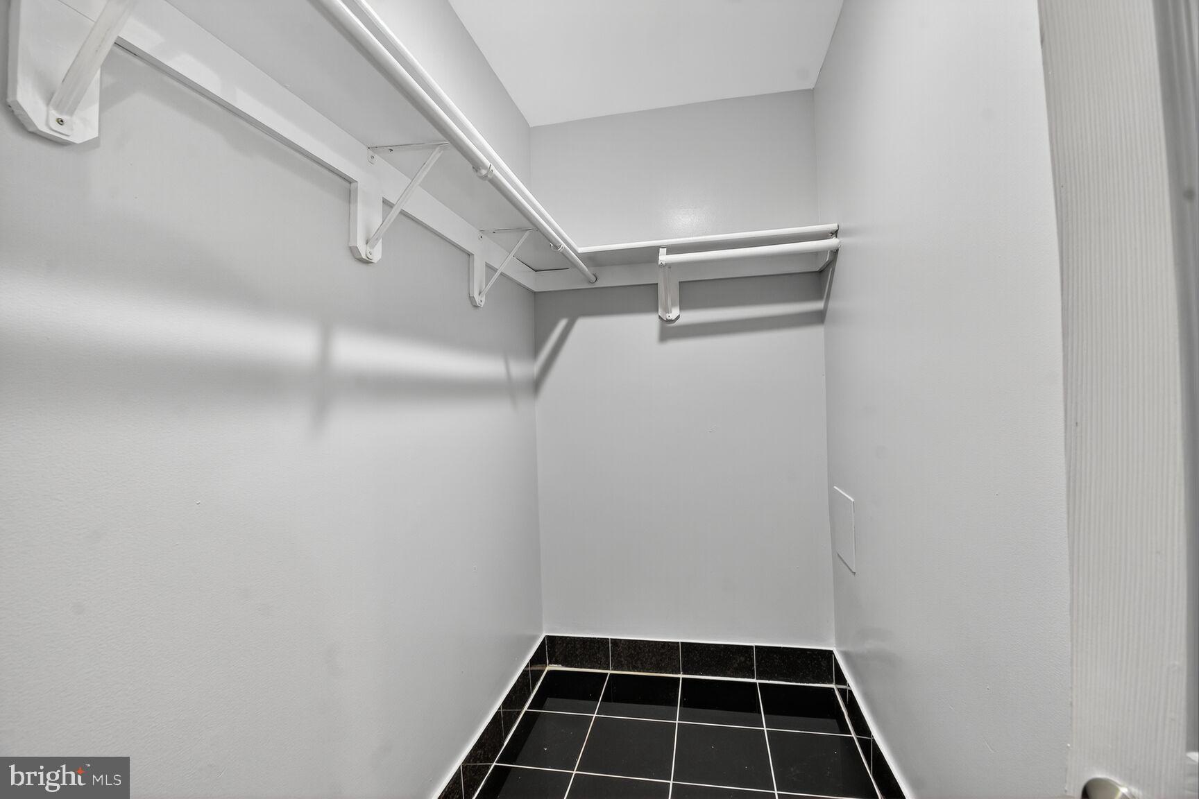 3976 Bel Pre Road, Unit 39761 Silver Spring, MD 20906 - Photo 9 of 19 a view of a room with shelf on the wall