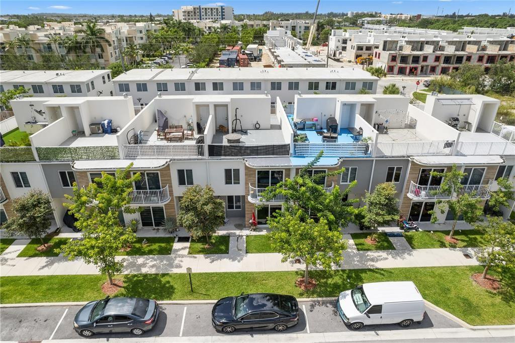 14474 Southwest 259th Street Homestead, FL 33032 - Photo 2 of 25 a house with lots of trees in the background