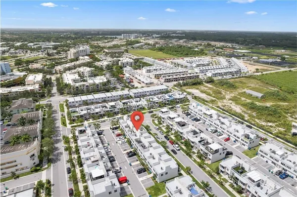 an aerial view of residential building and lake
