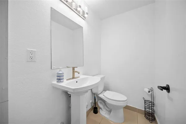 a view of a bedroom with washer and dryer
