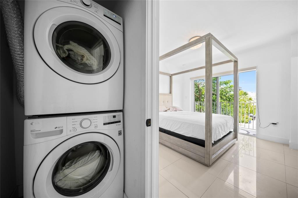 14474 Southwest 259th Street Homestead, FL 33032 - Photo 10 of 25 a view of a bedroom with washer and dryer