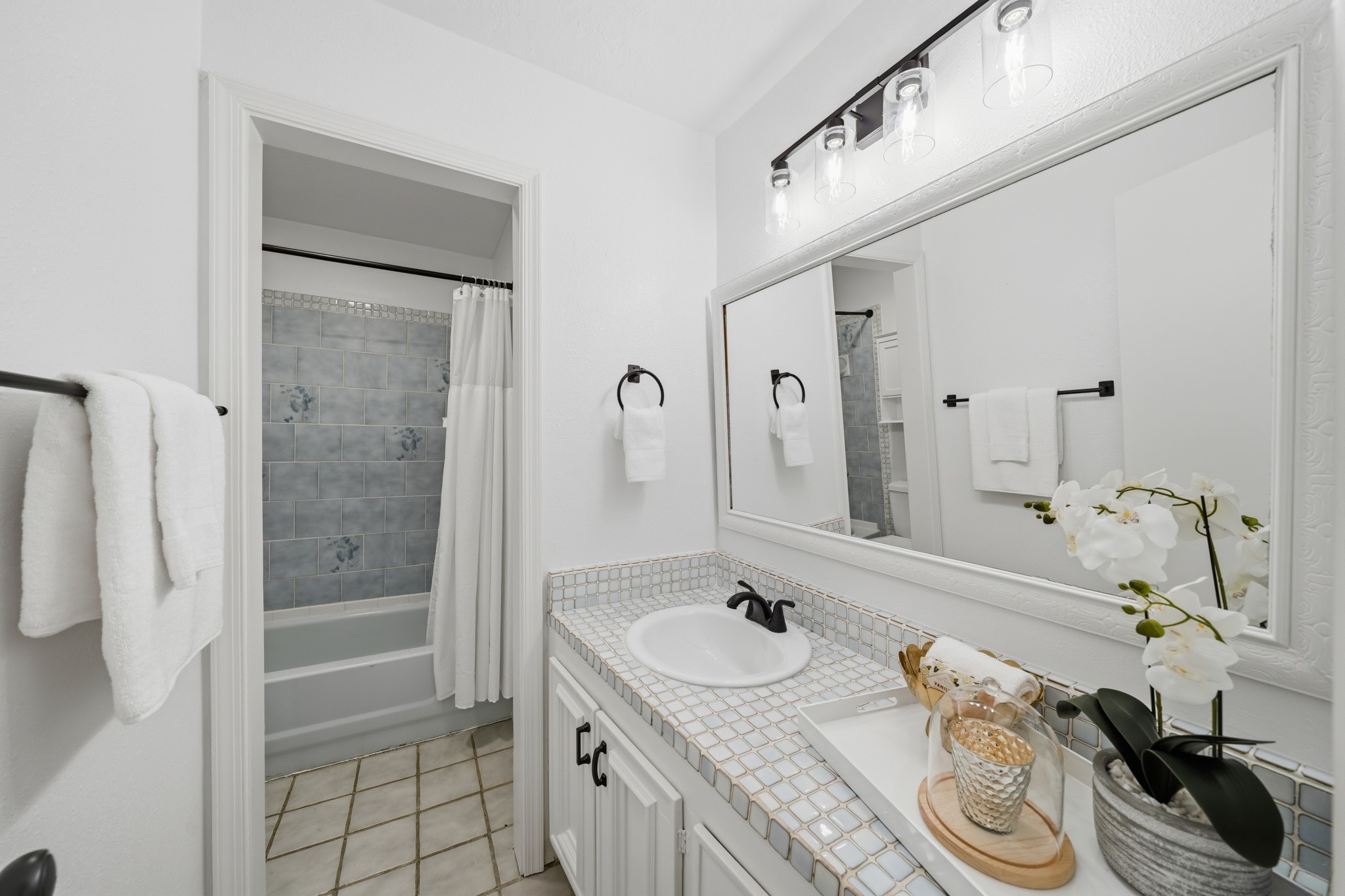 79 Summers Wind Street Conroe, TX 77356 - Photo 29 of 45 a bathroom with a granite countertop sink and a mirror
