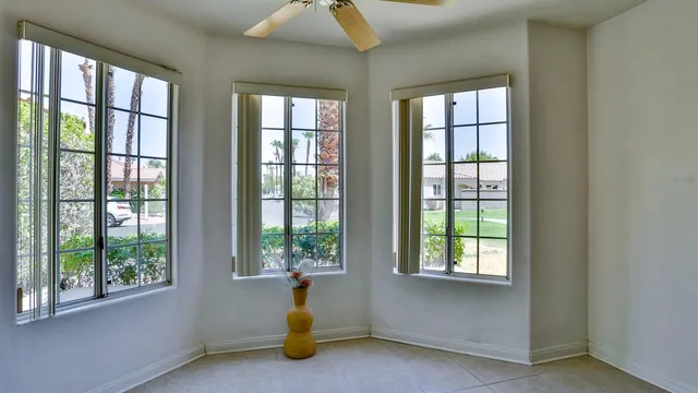 a view of a livingroom with a window and outside view
