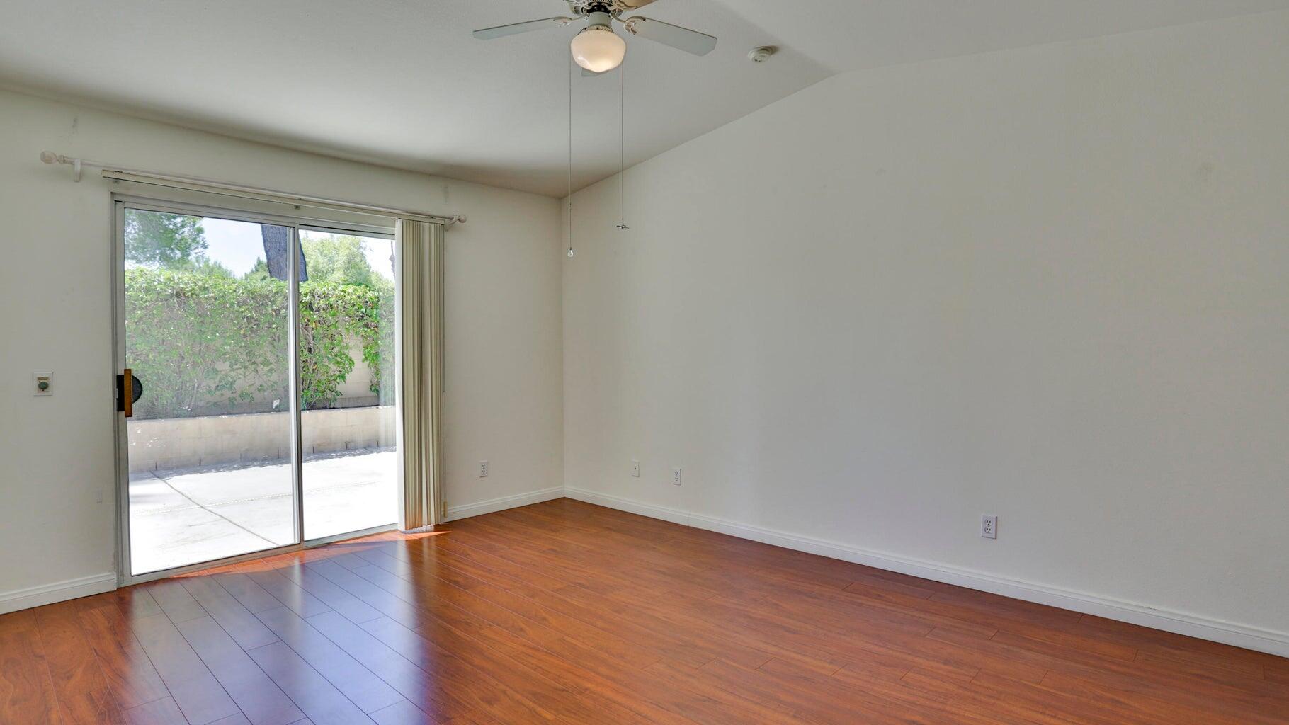 77861 Villa Road Palm Desert, CA 92211 - Photo 21 of 24 a view of a livingroom with wooden floor and a large window
