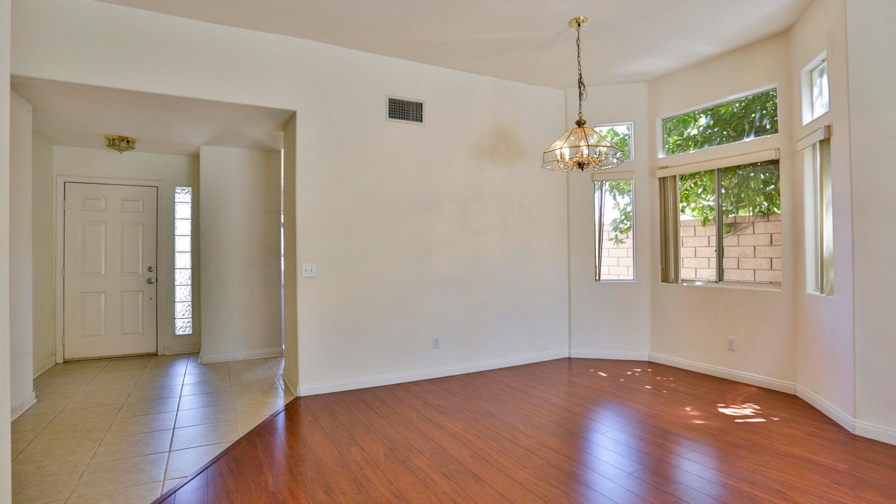 77861 Villa Road Palm Desert, CA 92211 - Photo 7 of 24 a view of livingroom with window and hardwood floor