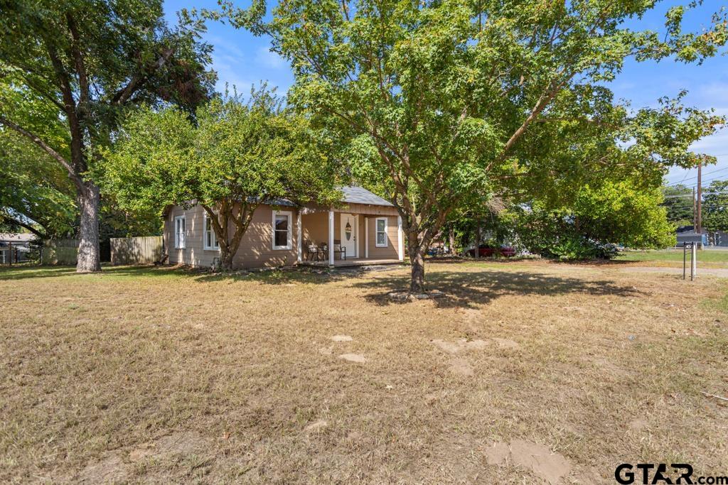 107 Mallory Street Lindale, TX 75771 - Photo 2 of 33 a front view of a house with a yard