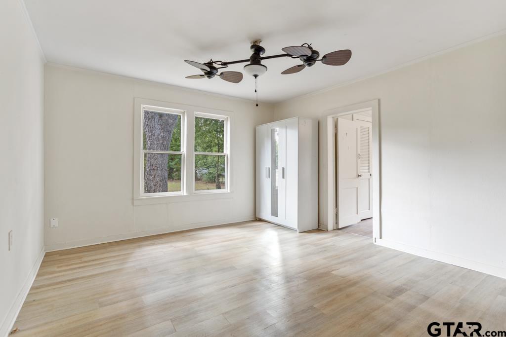 107 Mallory Street Lindale, TX 75771 - Photo 21 of 33 a view of livingroom with a ceiling fan and window