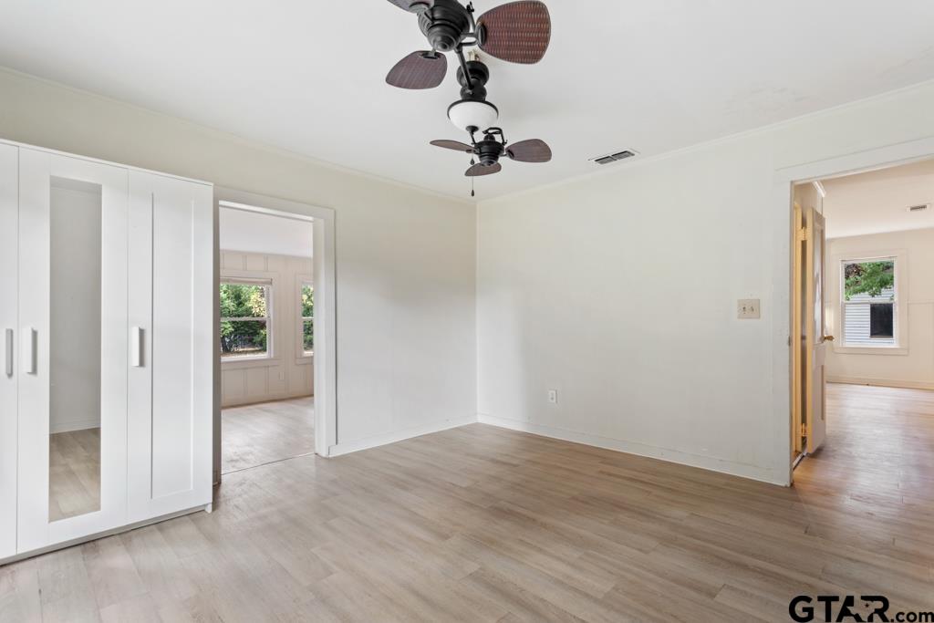 107 Mallory Street Lindale, TX 75771 - Photo 22 of 33 wooden floor in an empty room with a window