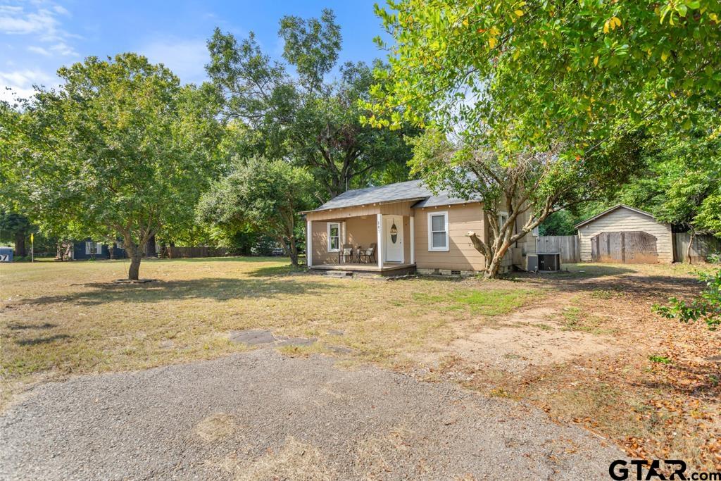 107 Mallory Street Lindale, TX 75771 - Photo 32 of 33 a front view of house with yard and trees