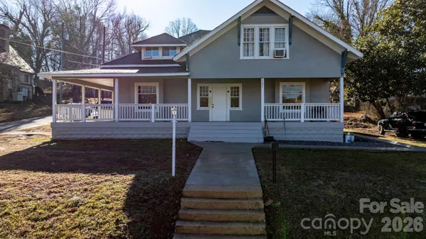 a front view of a house with yard
