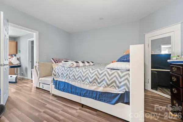 a bedroom with a bed and a table