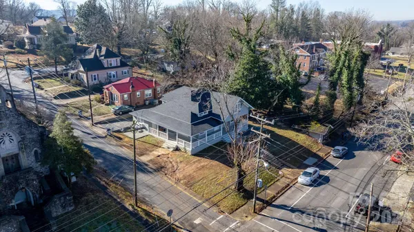 an aerial view of a houses with yard