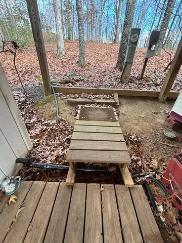 a bench sitting in front of a door