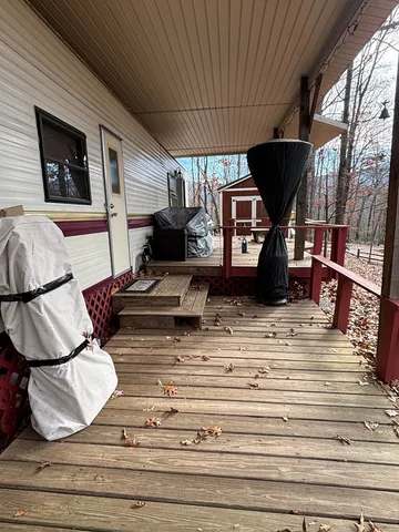 a view of a grassy field with trees