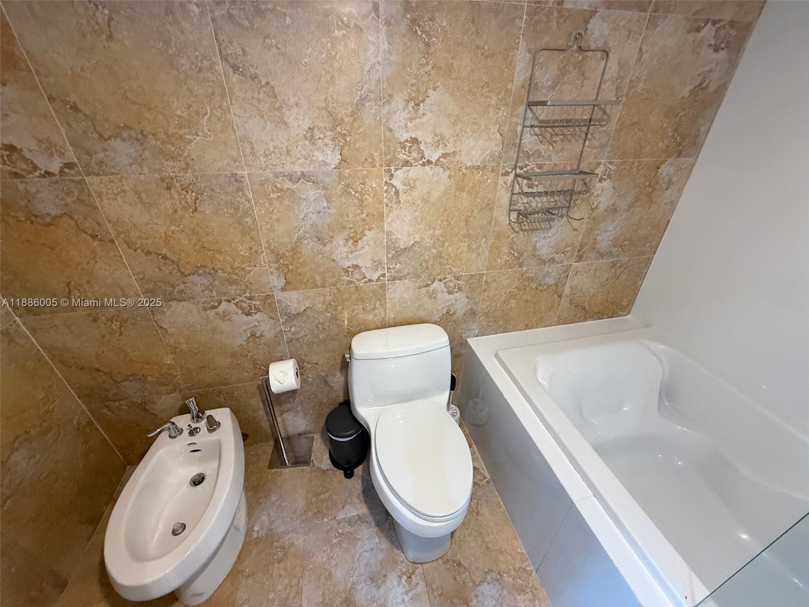 1500 Bay Road, Unit 122S Miami Beach, FL 33139 - Photo 18 of 44 a bathroom with a toilet and a shower
