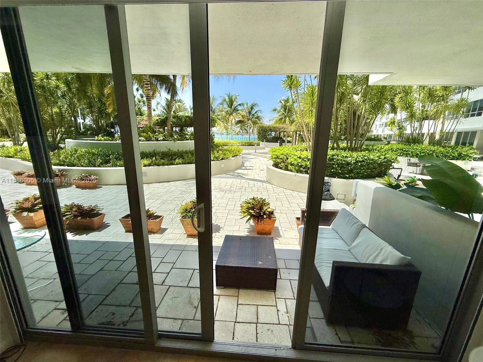 1500 Bay Road, Unit 122S Miami Beach, FL 33139 - Photo 2 of 44 a view of living room with furniture
