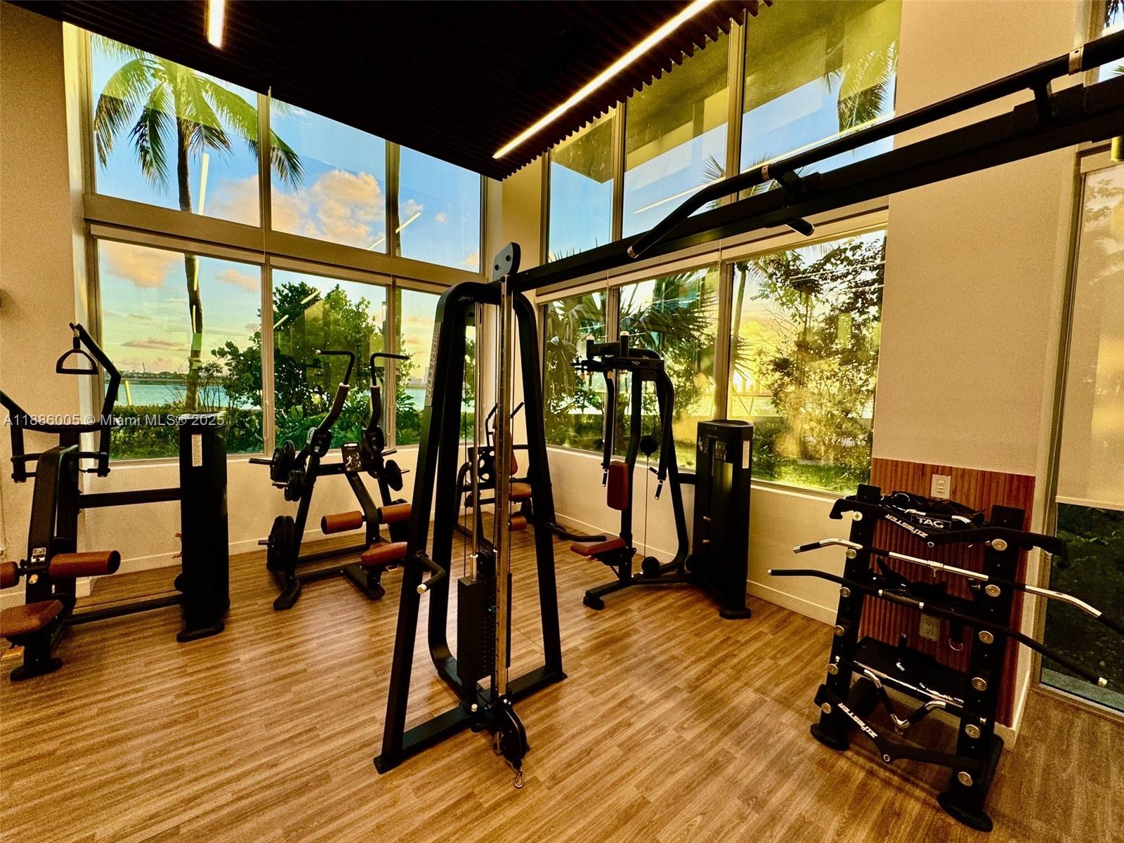 1500 Bay Road, Unit 122S Miami Beach, FL 33139 - Photo 28 of 44 a view of a room with wooden floor and furniture