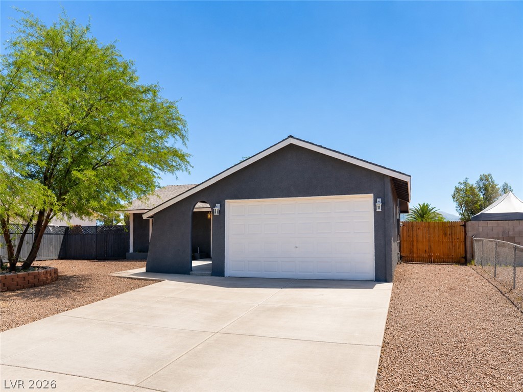 2870 South Sandhill Road Las Vegas, NV 89121 - Photo 8 of 64 A well-maintained facade with a private garage offers comfortable living.