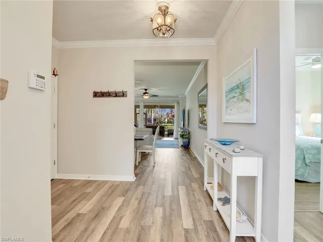 a view of a room with furniture and wooden floor