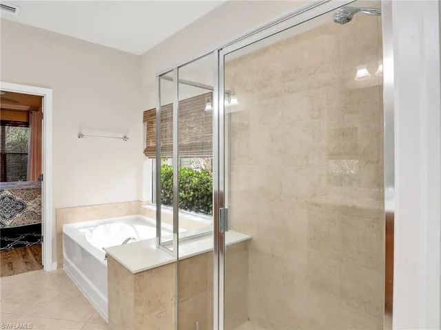 a bedroom with a bed and a table in it