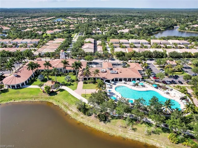 an aerial view of a house with yard swimming pool and outdoor seating