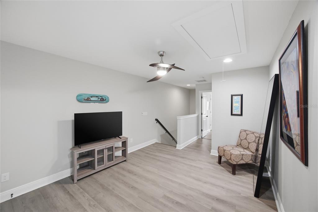 2013 Sunset Wind Loop Oldsmar, FL 34677 - Photo 14 of 43 a living room with furniture and a flat screen tv