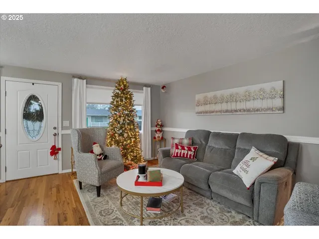 a living room with furniture and a table