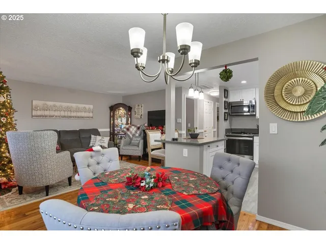 a living room with furniture and kitchen view