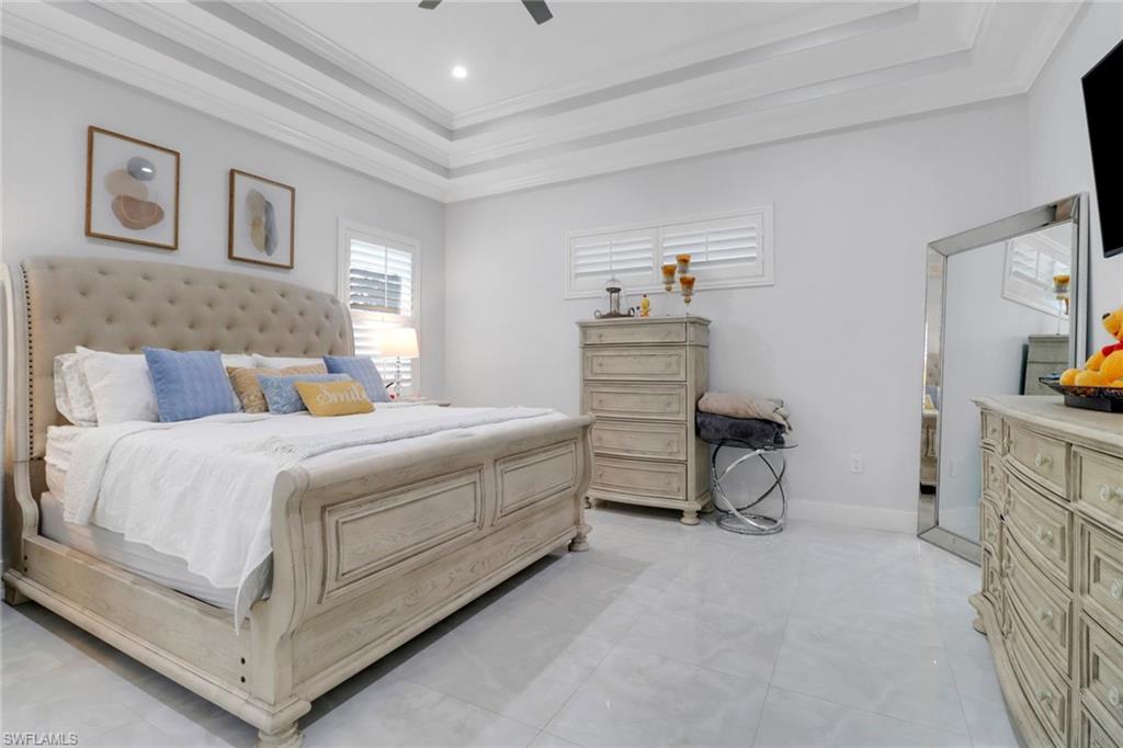 1086 21st Street Southwest Naples, FL 34117 - Photo 19 of 50 a bedroom with a bed and a cabinets