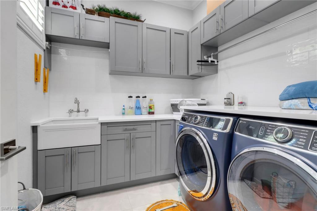 1086 21st Street Southwest Naples, FL 34117 - Photo 28 of 50 a utility room with sink dryer and washer