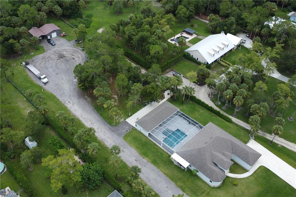 1086 21st Street Southwest Naples, FL 34117 - Photo 44 of 50 an aerial view of a house with garden space and street view