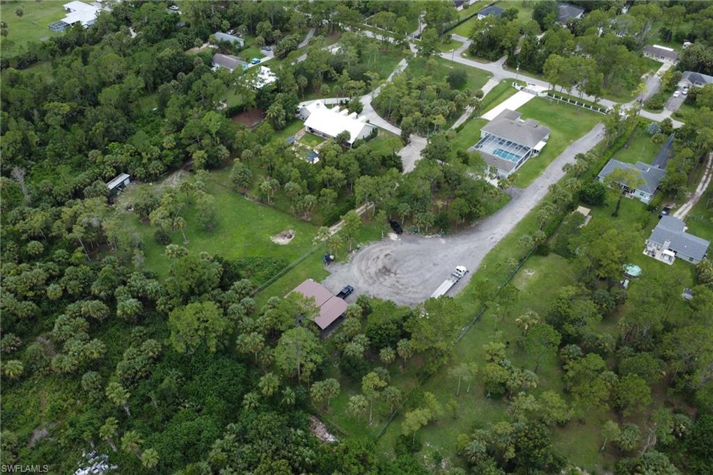 1086 21st Street Southwest Naples, FL 34117 - Photo 45 of 50 a view of a yard with potted plants