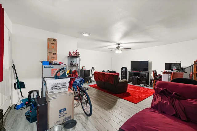a bedroom with two bed and a flat screen tv
