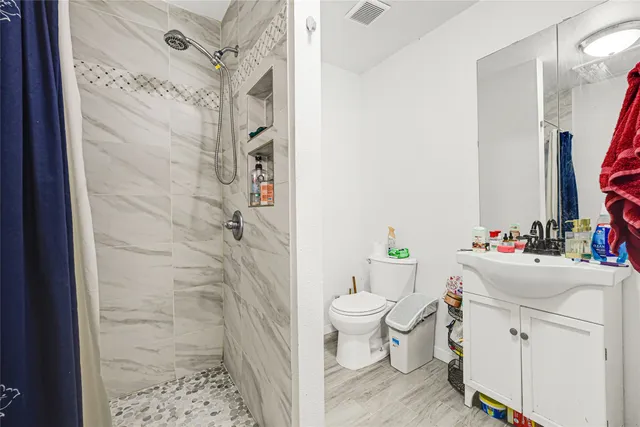 a view of hallway with wooden floor