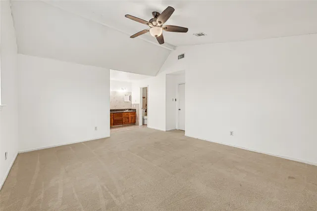 a bathroom with a toilet a sink and shower